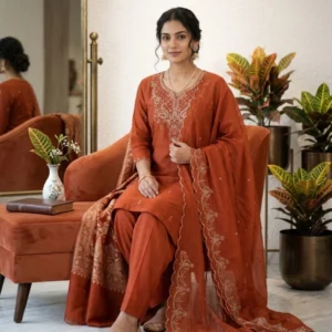 Rust orange organza straight suit with golden pipe work and farshi bottom for women