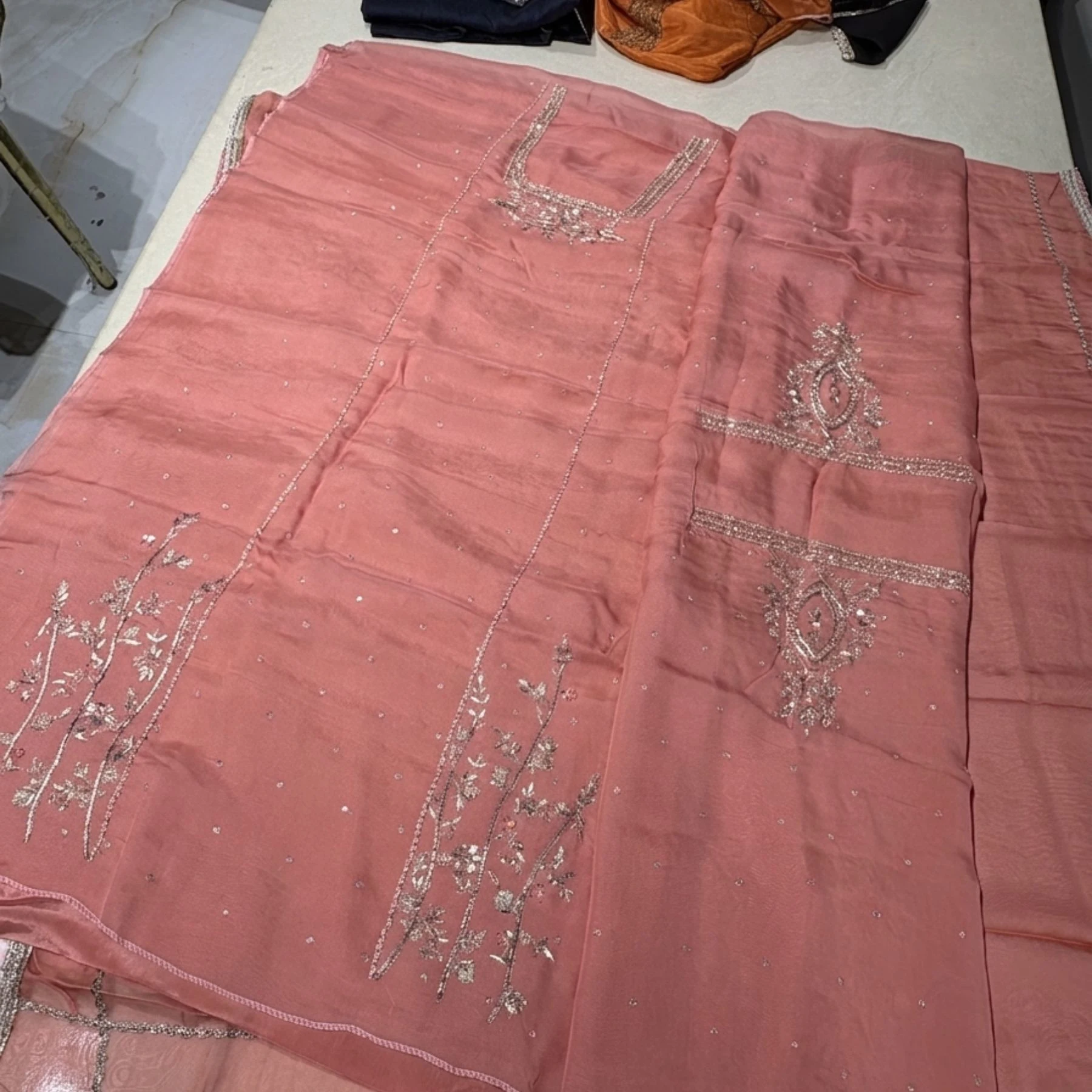 Pink organza unstitched suit with sippi cut daana and dabka work by Kharatis