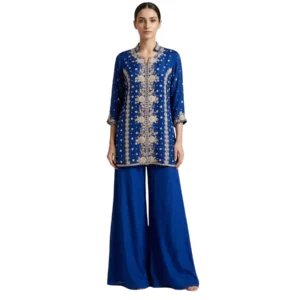 Woman wearing royal blue chinnon pearl work co-ord set