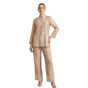 Woman wearing beige chinnon thread work co-ord set