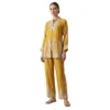 Woman wearing mustard chinnon co-ord set with thread work