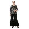 Woman wearing black printed chinnon garara co-ord set with pearl work jacket