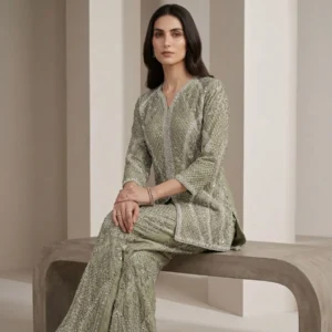 Woman wearing sage green organza pearl work co-ord set with dupatta