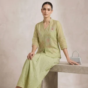 Woman wearing sage green soft organza embroidered co-ord set