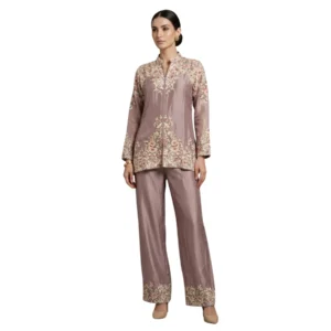 Woman wearing mauve chinnon embroidered co-ord set with multicolor thread work