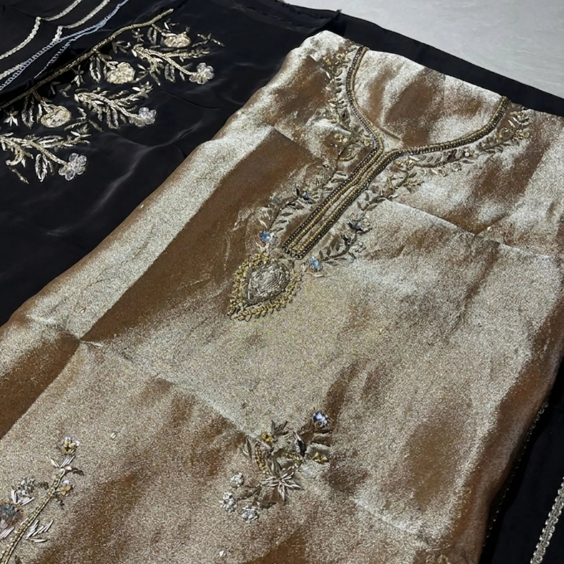 Women’s golden shimmer unstitched suit with dabka work