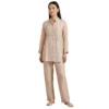 Woman wearing blush pink organza embroidered co-ord set with pearl work
