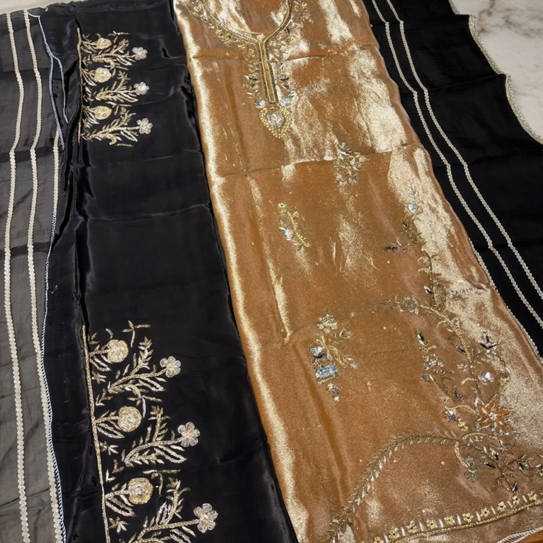 Women’s golden shimmer unstitched suit with dabka work
