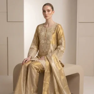 Woman wearing gold shimmer pearl work bell bottom co-ord set with dupatta