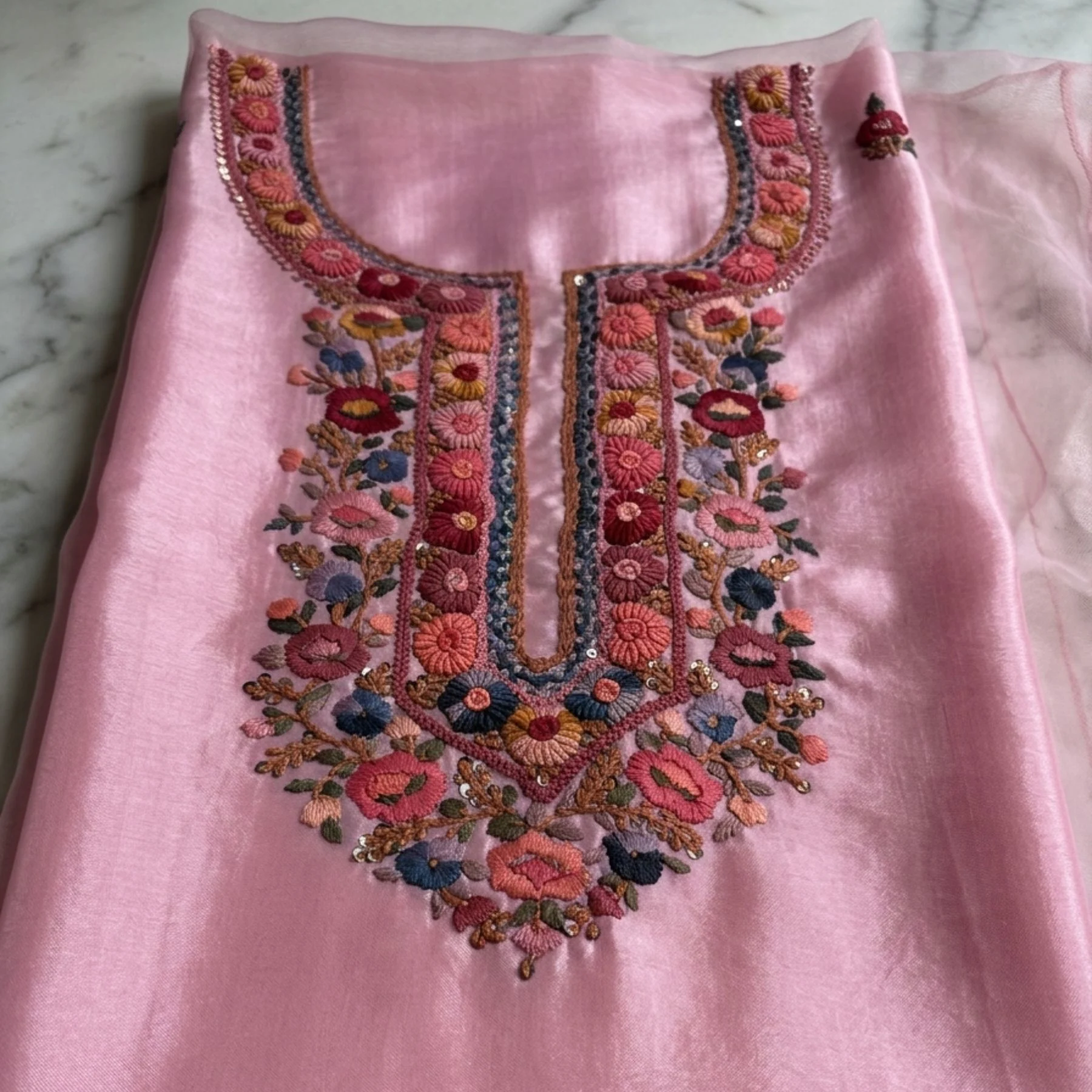 Pink georgette unstitched suit with thread knot work on neck by Kharatis
