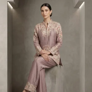 Woman wearing mauve chinnon embroidered co-ord set with multicolor thread work