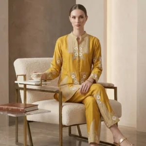 Woman wearing mustard chinnon co-ord set with thread work