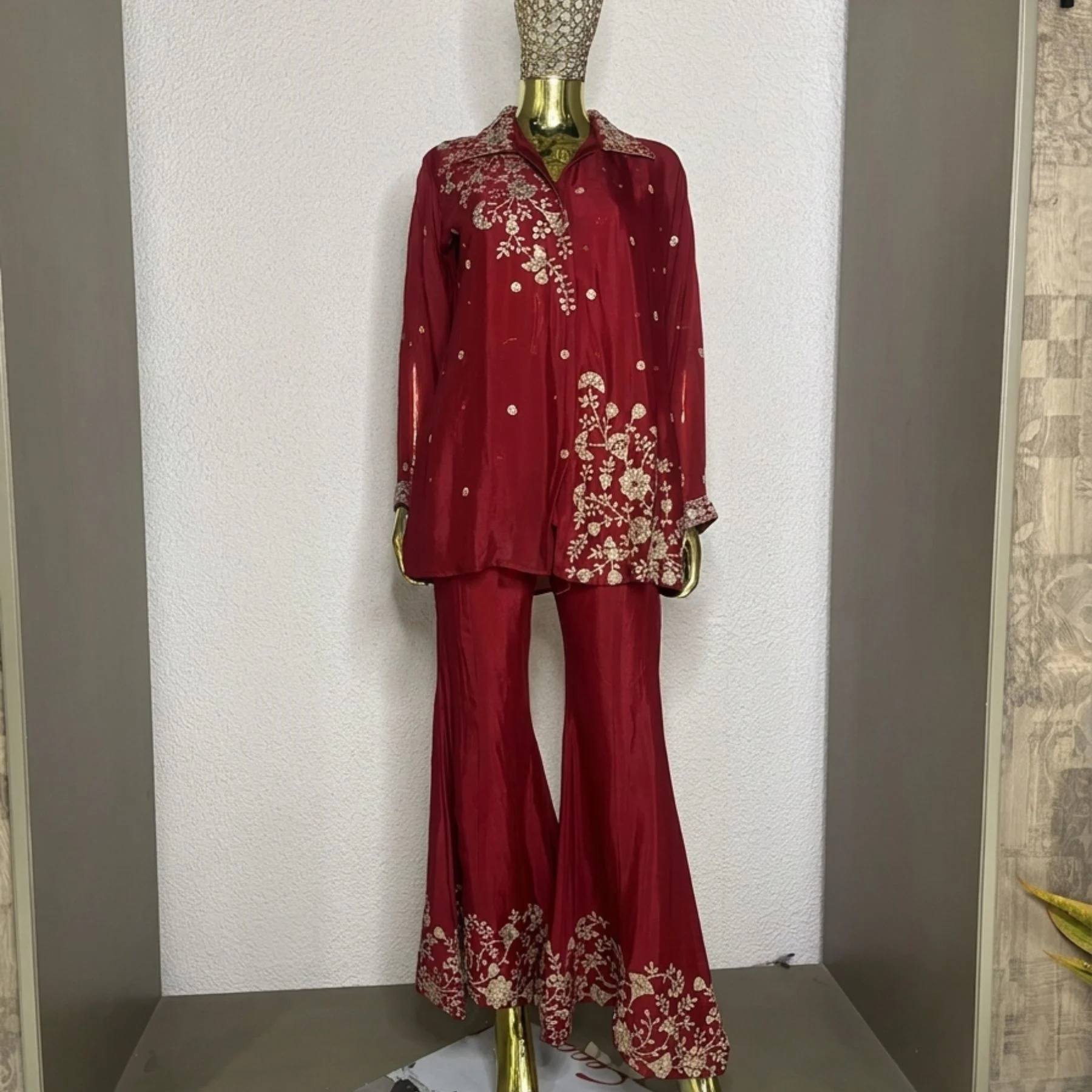 Woman wearing wine chinnon zari work embroidered co-ord set