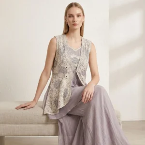 Woman wearing lavender chinnon co-ord set with embroidered organza jacket