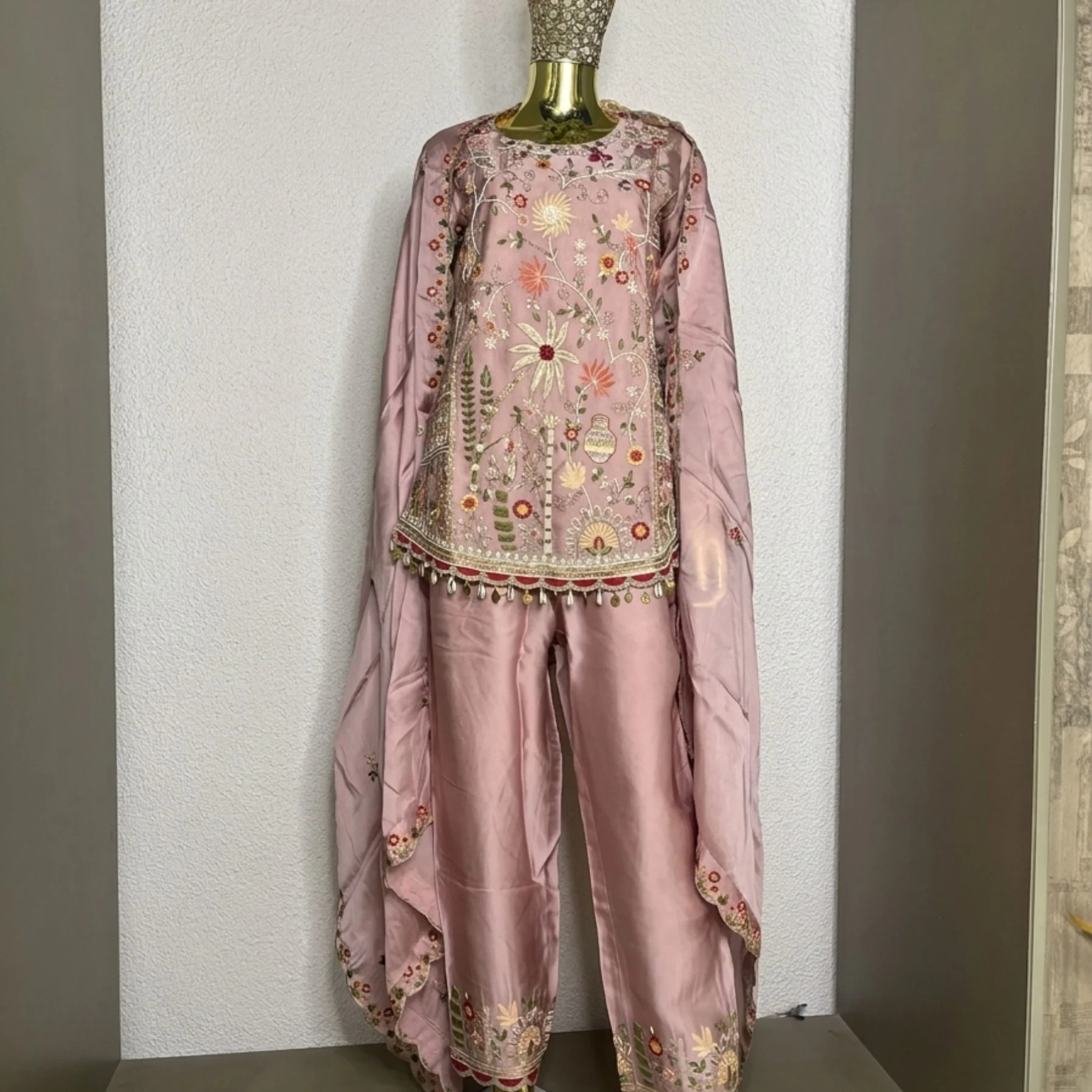 Woman wearing blush pink khadi chanderi suit set with dupatta