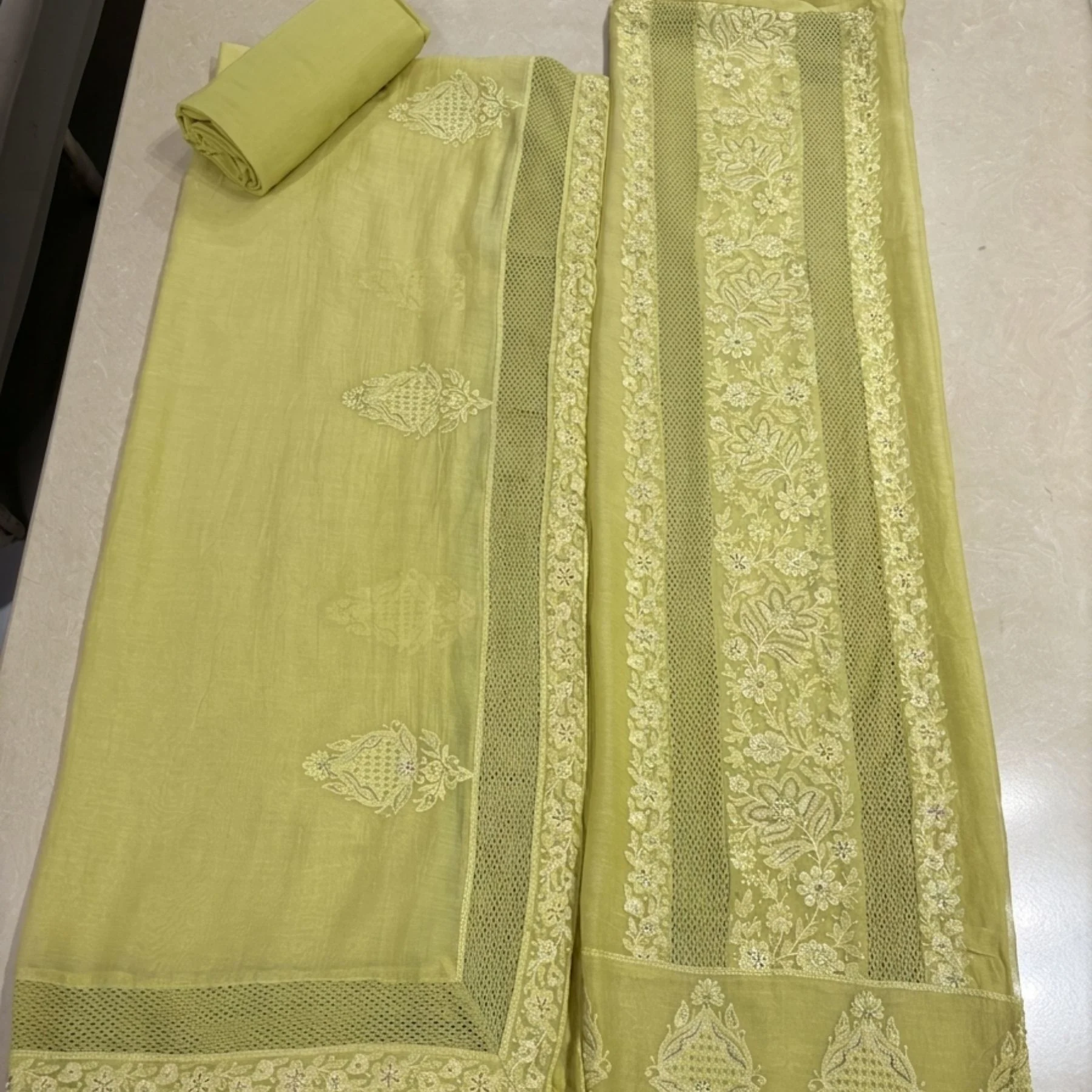 Vibrant soft lime green unstitched suit with Chikankari embroidery by Kharatis