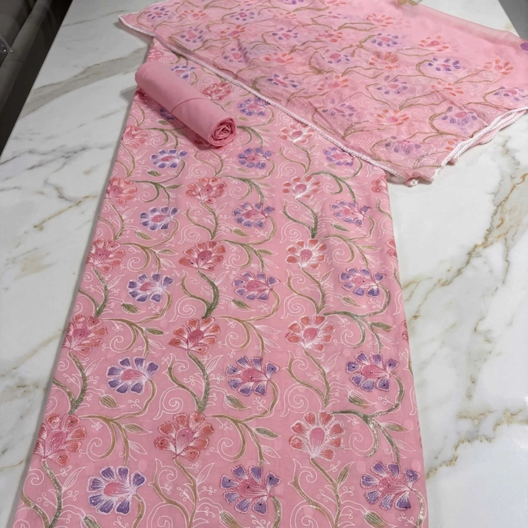 Light soft pink cambric cotton unstitched suit with floral paint design by Kharatis
