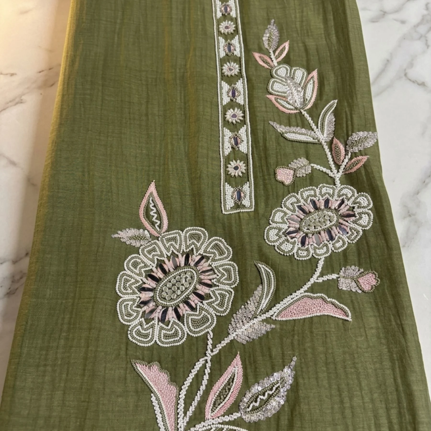 Rich olive green unstitched suit with floral embroidery, thread work and bead work by Kharatis
