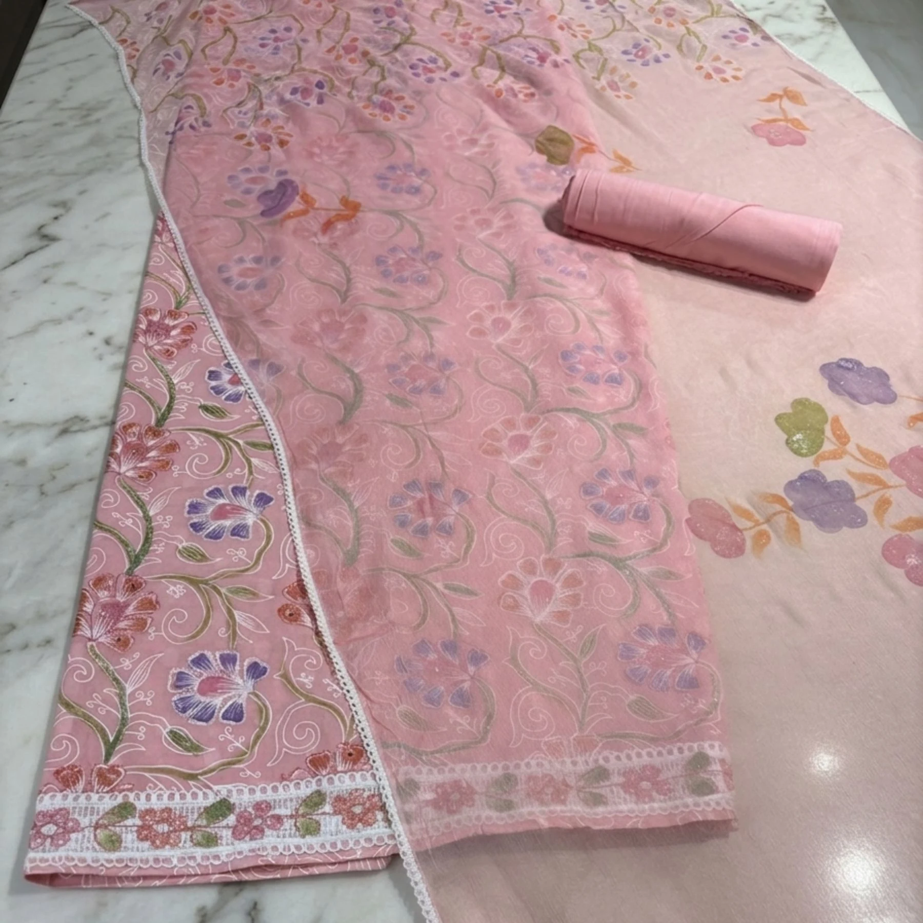 Light soft pink cambric cotton unstitched suit with floral paint design by Kharatis