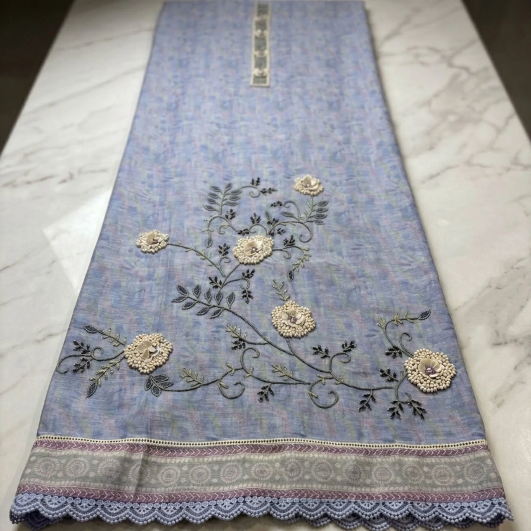 Lilac powder blue unstitched suit with appliqué petals and bead work by Kharatis