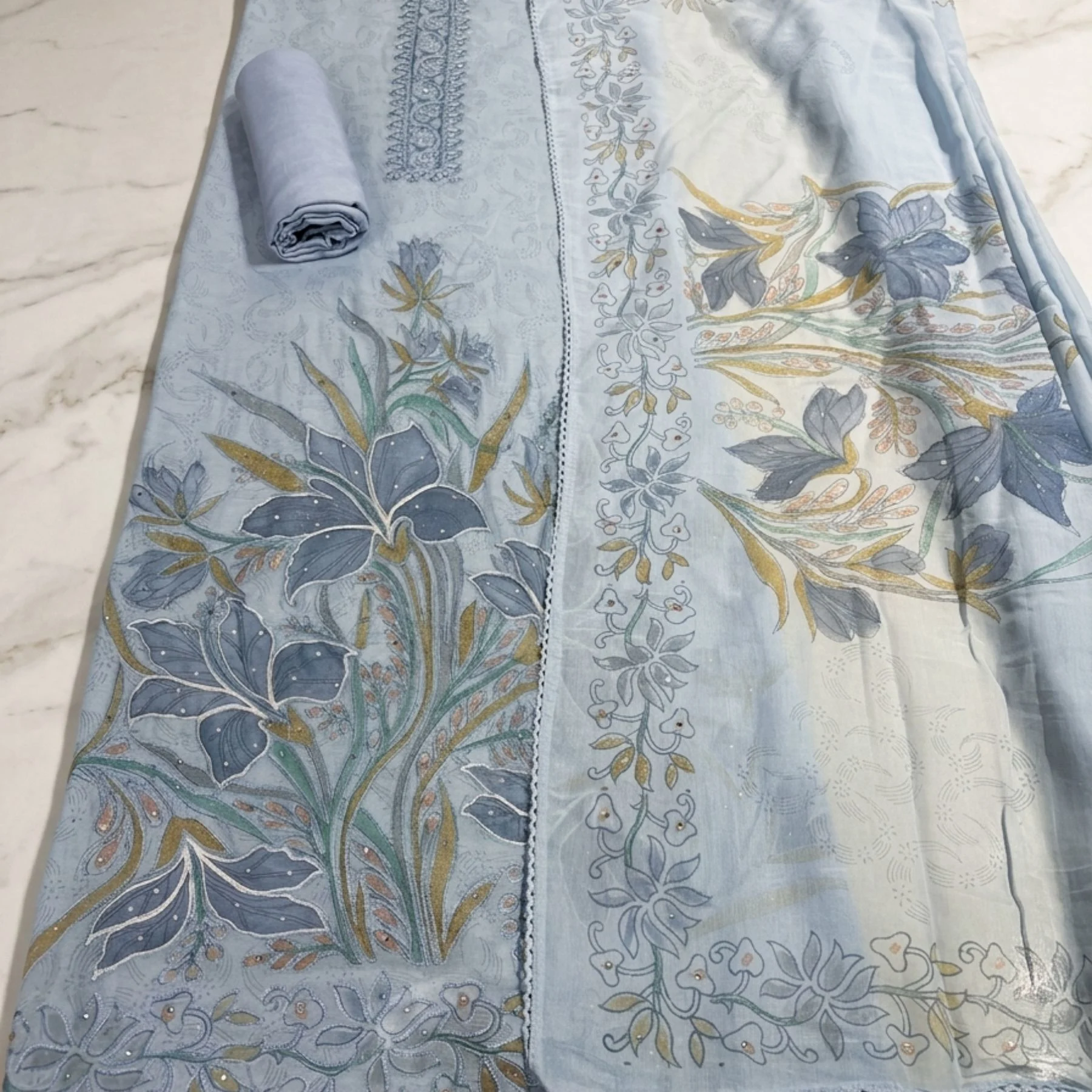 Light monochromatic sky blue mul cotton unstitched suit with paint work and Aari embroidery by Kharatis