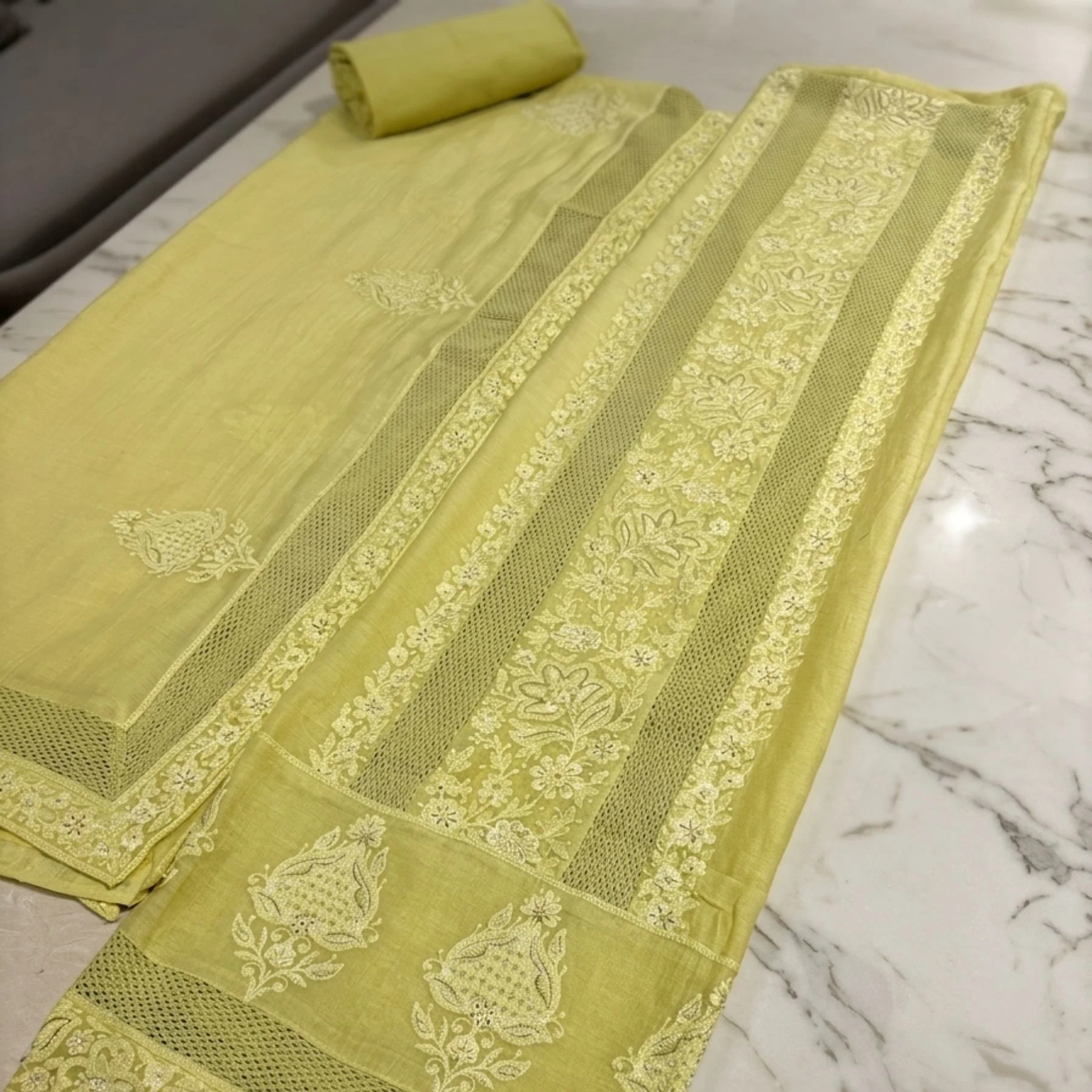 Vibrant soft lime green unstitched suit with Chikankari embroidery by Kharatis