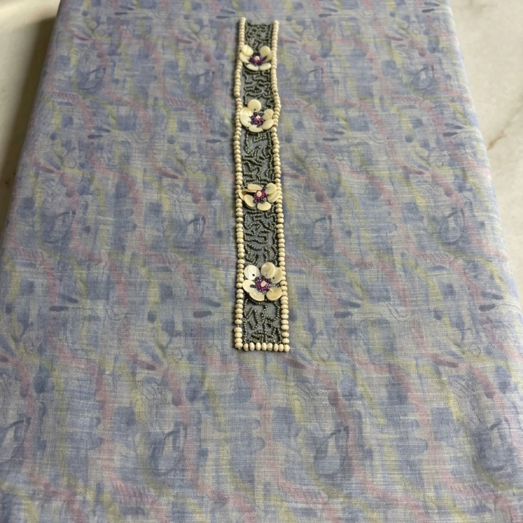 Lilac powder blue unstitched suit with appliqué petals and bead work by Kharatis