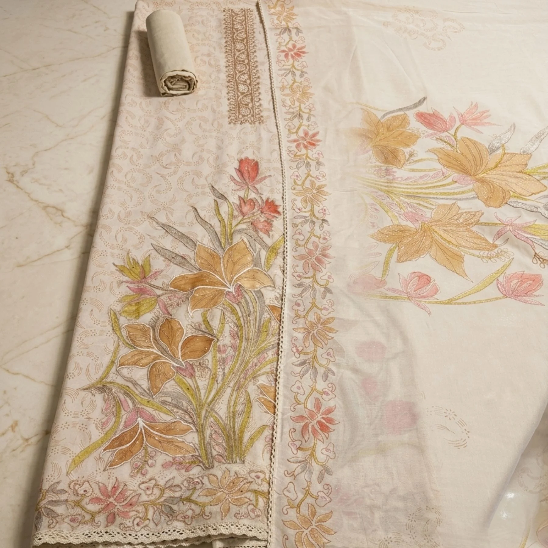 Warm beige mul cotton unstitched suit with floral motifs by Kharatis