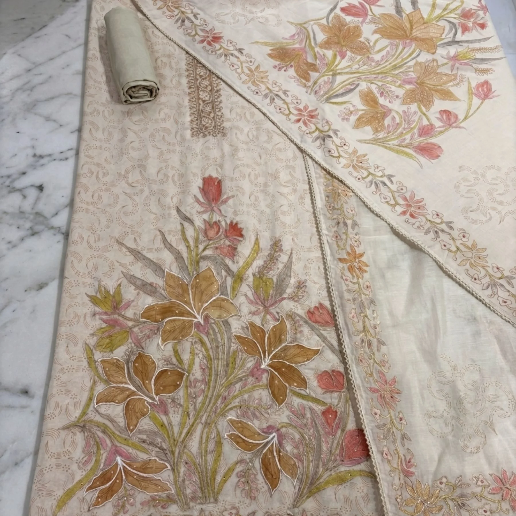 Warm beige mul cotton unstitched suit with floral motifs by Kharatis