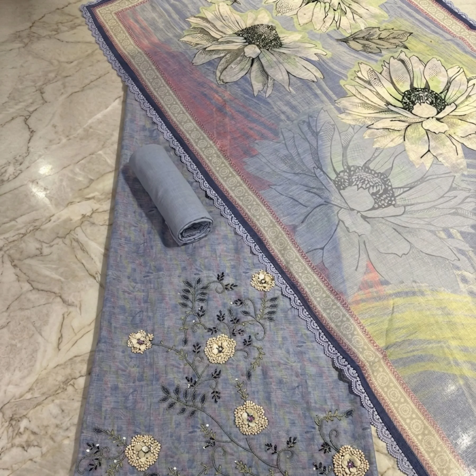 Lilac powder blue unstitched suit with appliqué petals and bead work by Kharatis